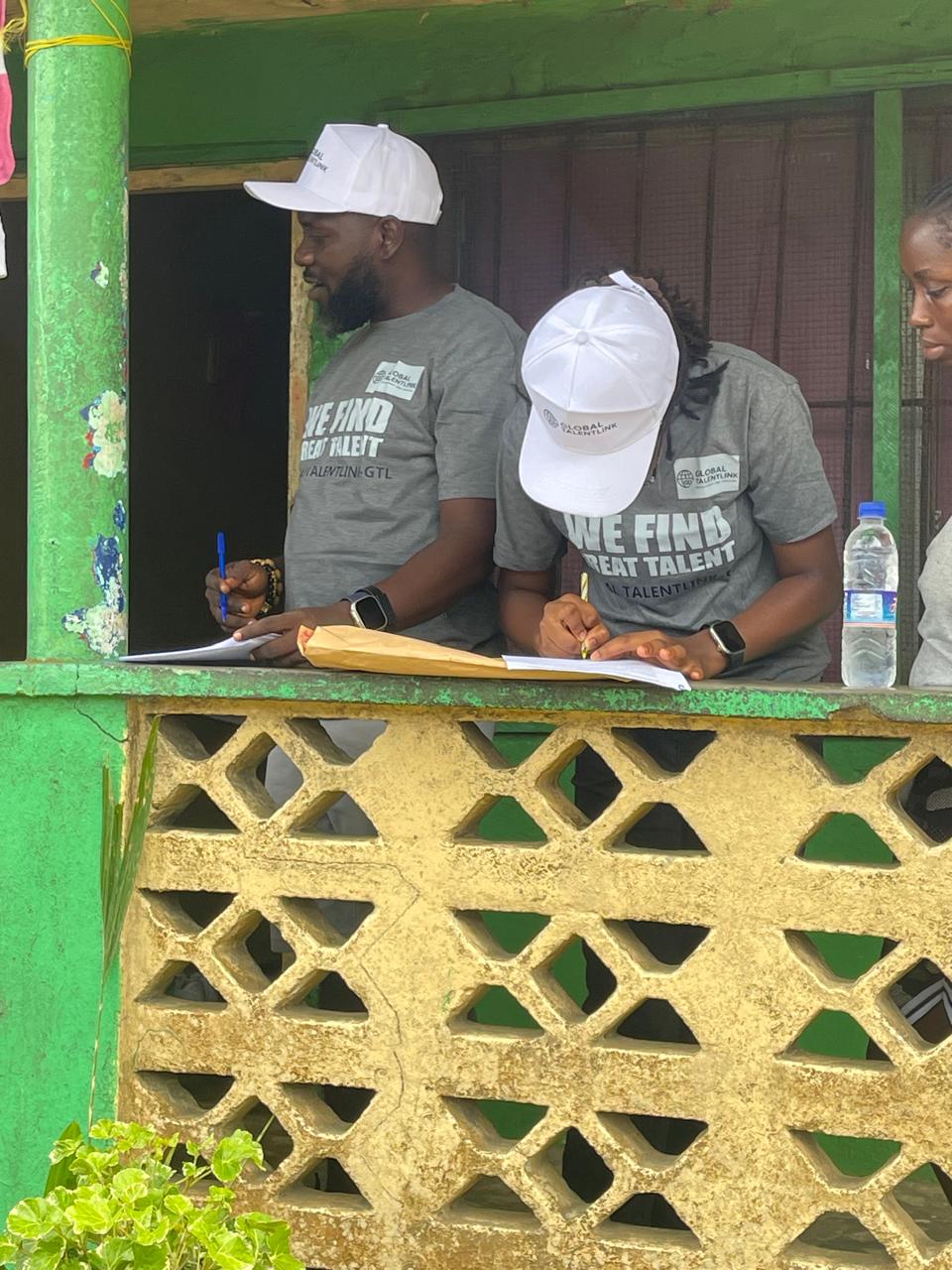 GTL staff filling out forms with candidates