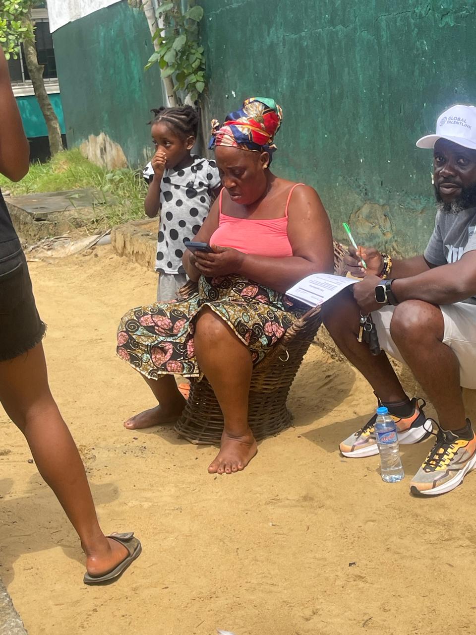 Woman completing forms while recruiter supports